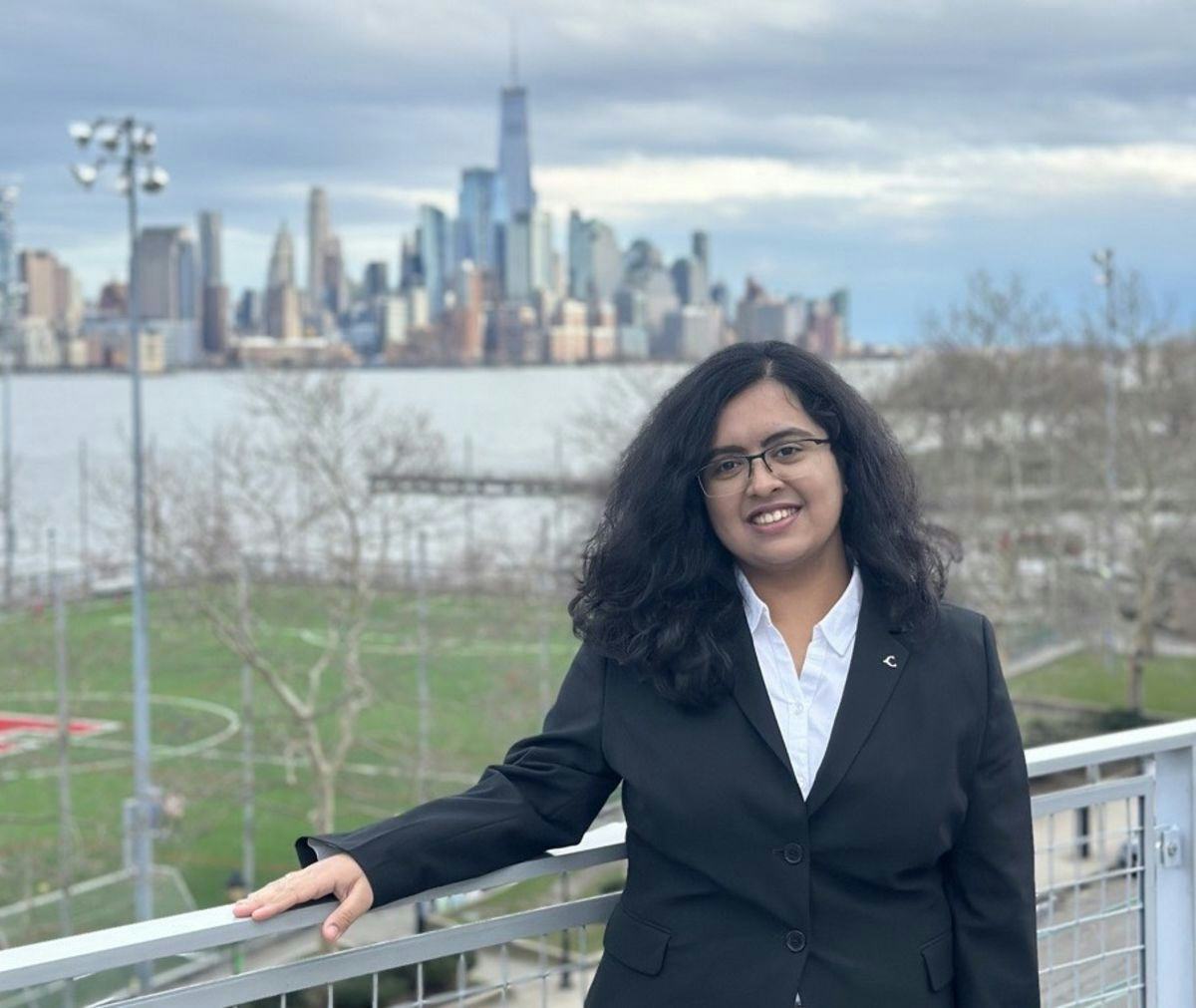 Rashi Wase posed in front of the New York City skyline.