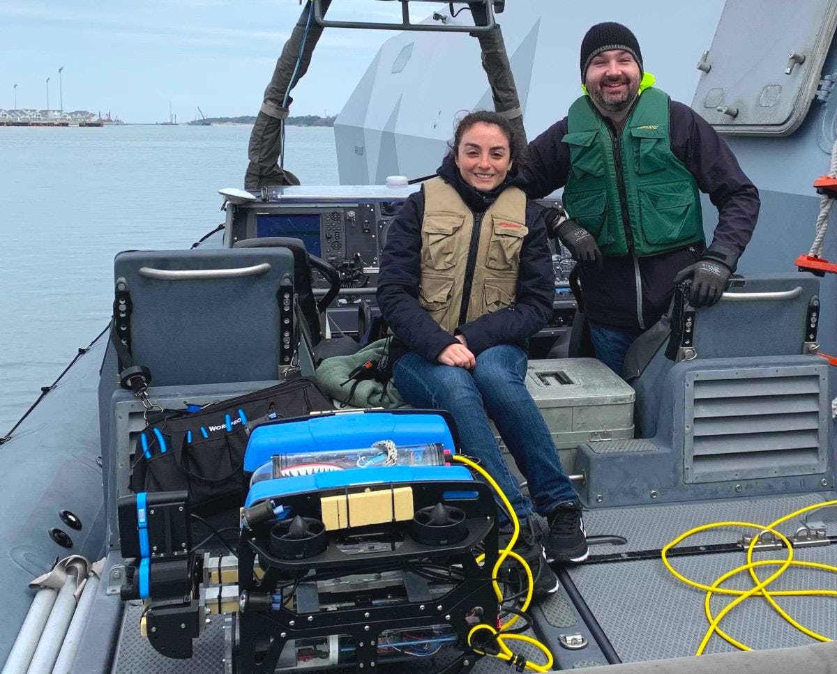 Stevens professor Brendan Englot and student with underwater robot on a dock