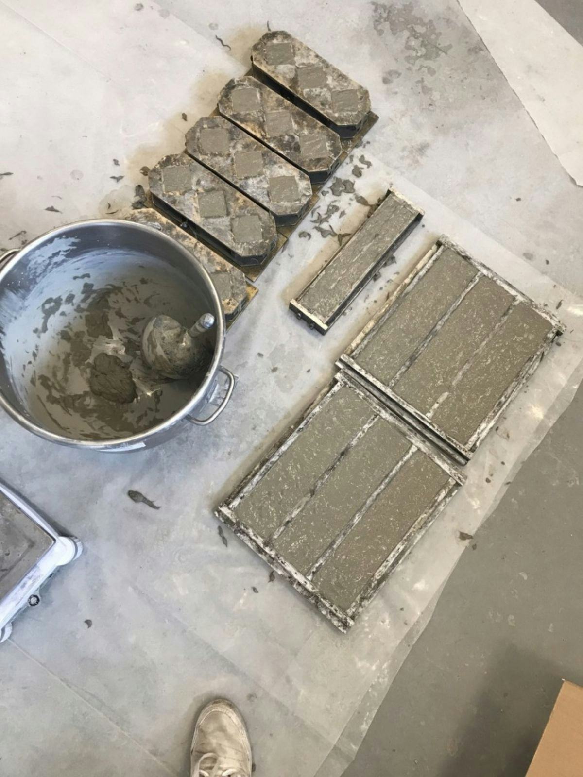 A photo of the casts filled with concrete.