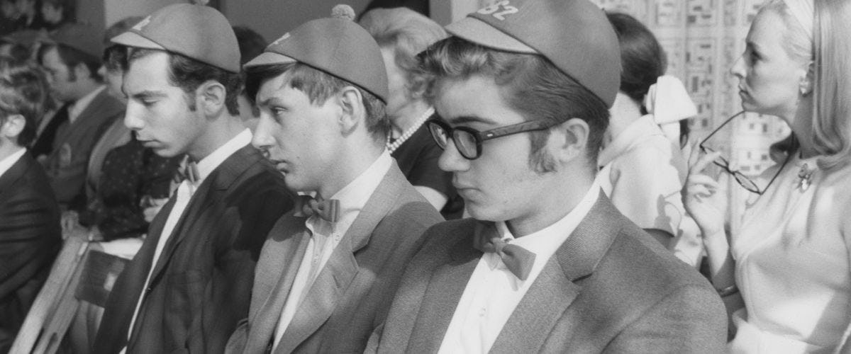 Black and white picture from the 1970s of Stevens students at convocation wearing dink hats.