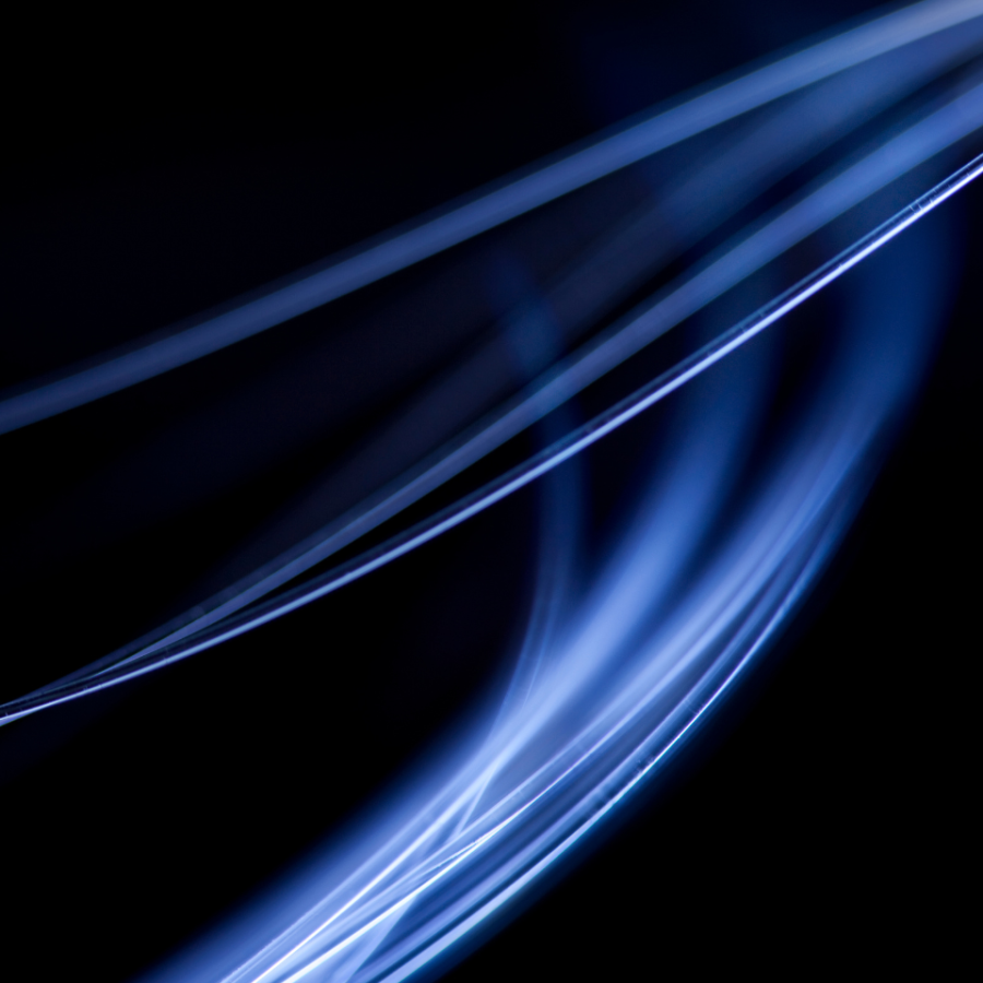 blue light bent by optical fibers