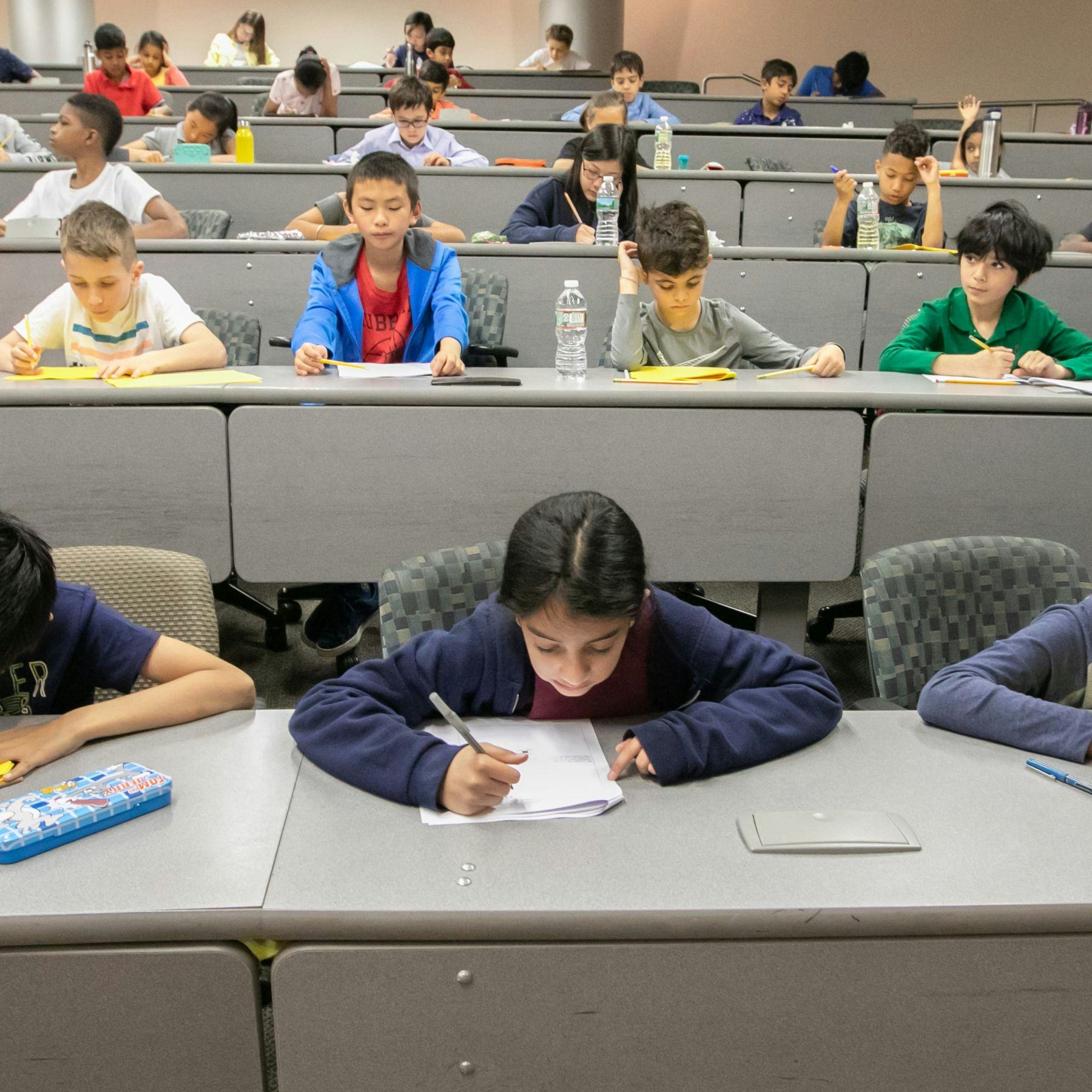 Students testing at the 2019 math olympiad