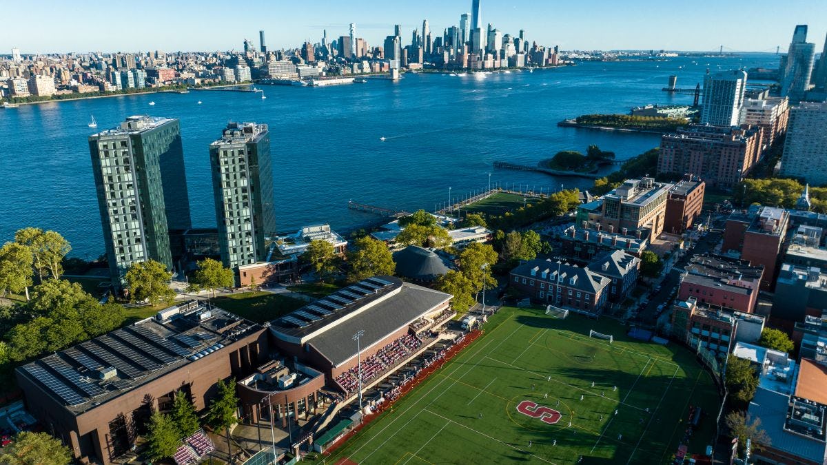 an aerial view of campus, the Hudson River and the NYC skyline