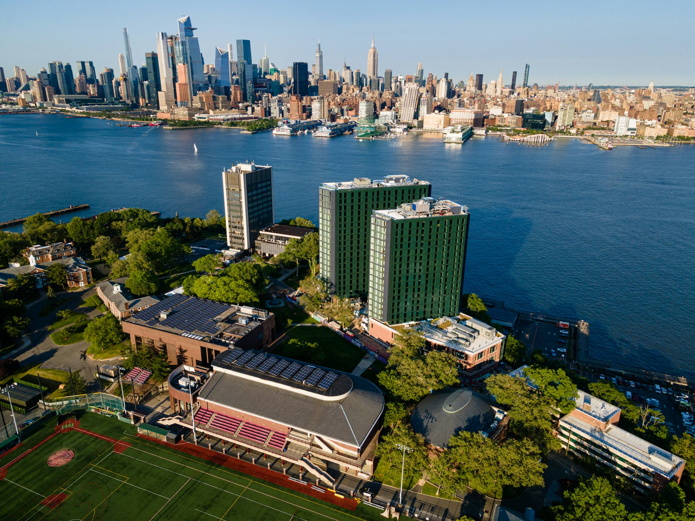 An aerial view of campus with New York City as the backdrop