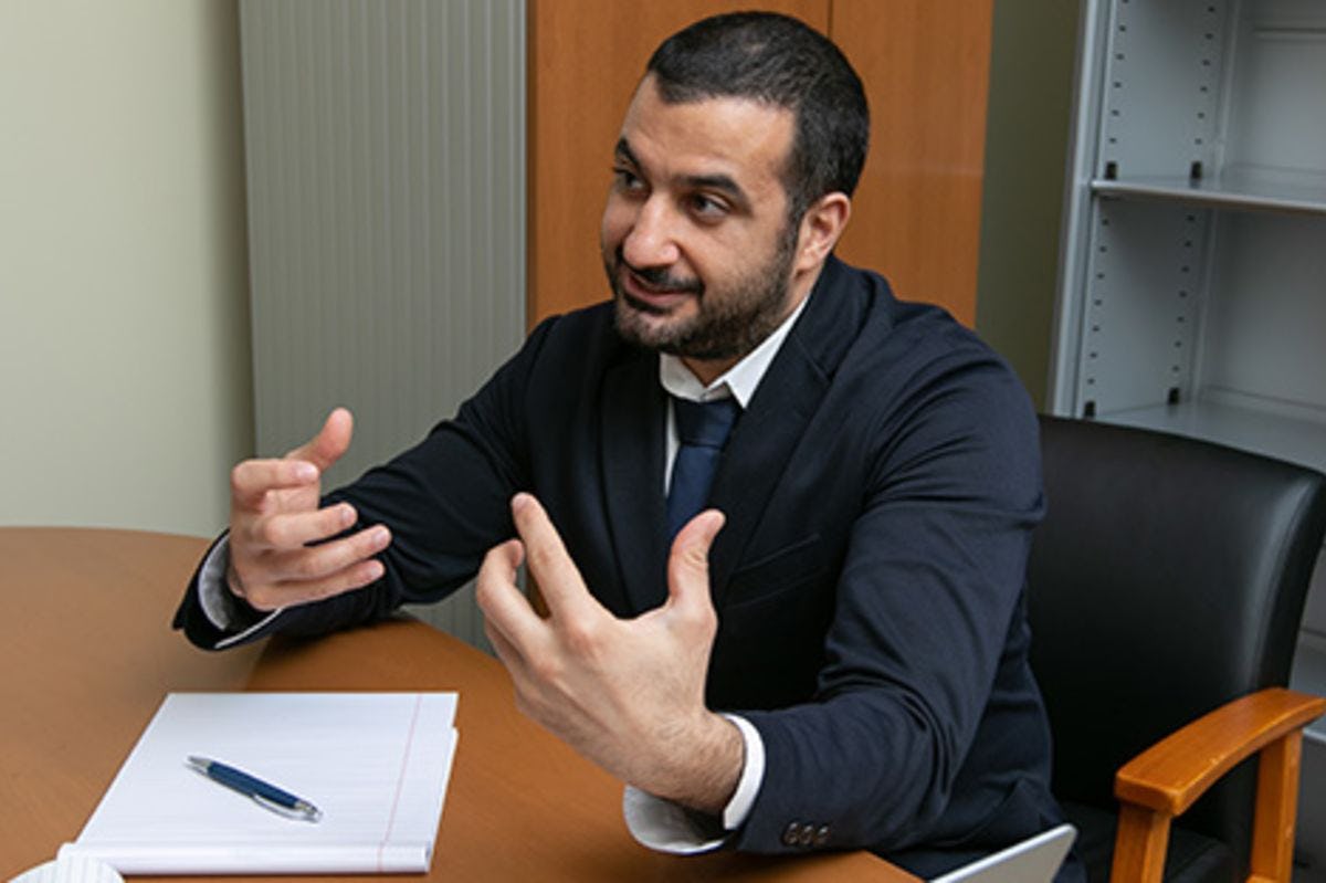 Majeed Simaan teaching at a desk