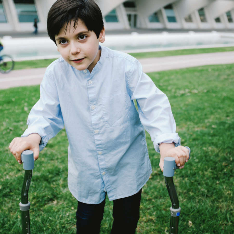 disabled child walking with pediatric crutches