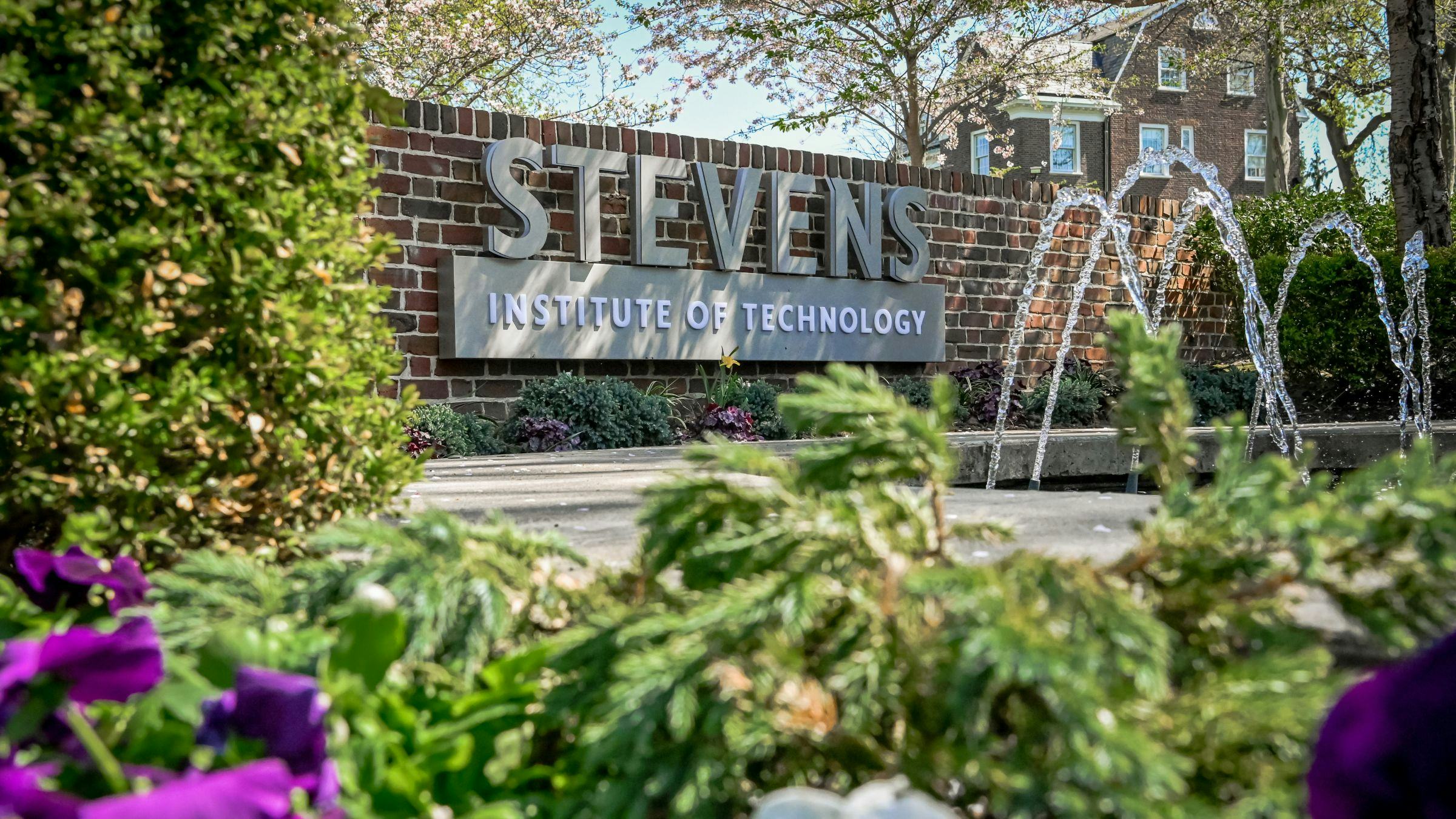 Stevens logo above a fountain and flowers