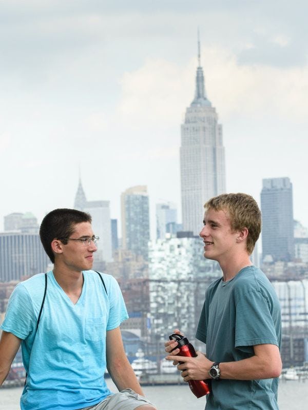 Students standing in front of the Empire State Building