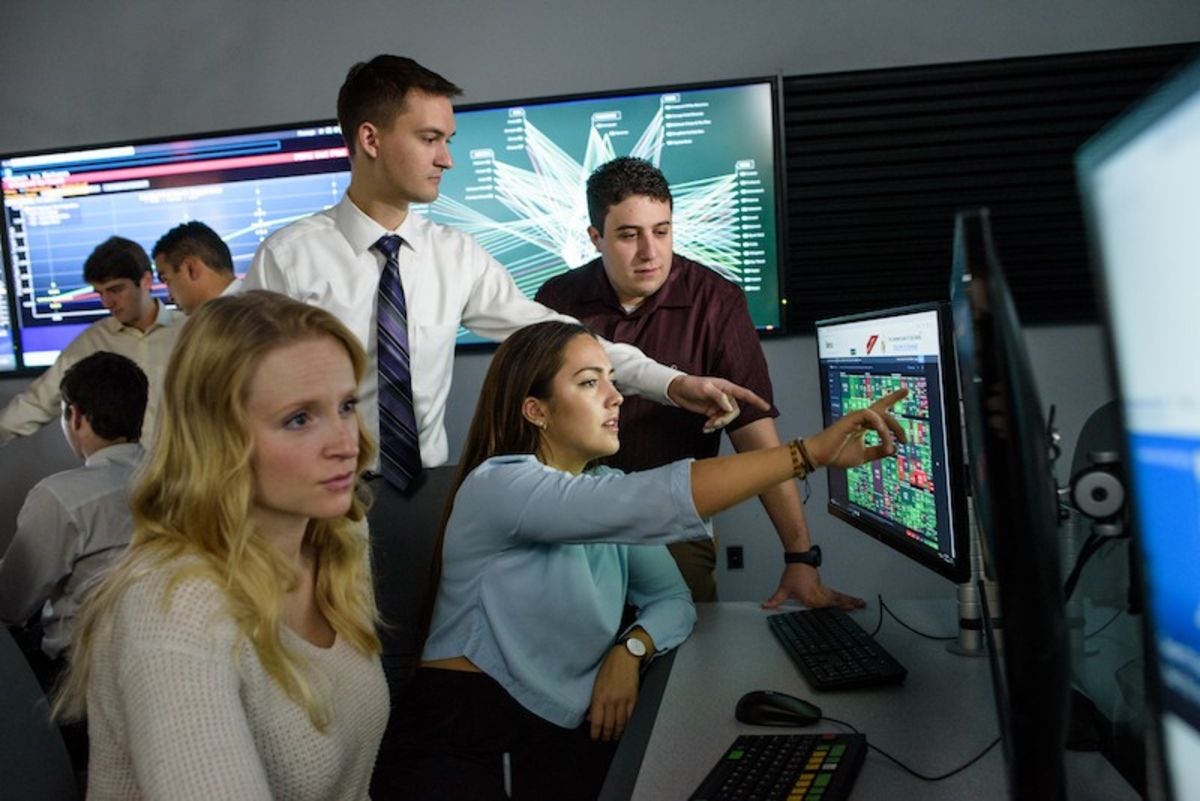 Students looking at computer screen