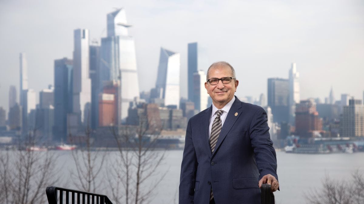 Stevens President Nariman Farvardin in front of the New York City skyline.