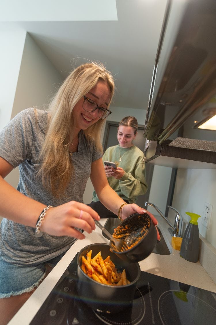 Students cook in dorm.