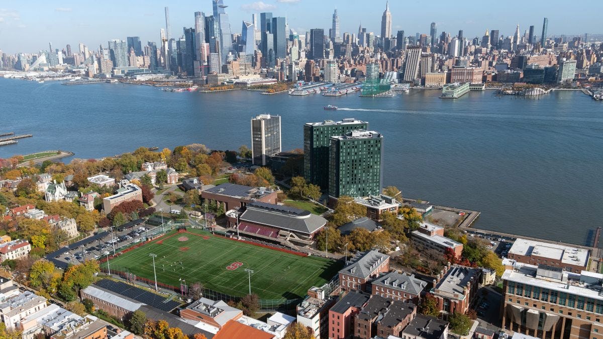 An aerial view of Stevens campus and the Manhattan skyline taken from a helicopter.