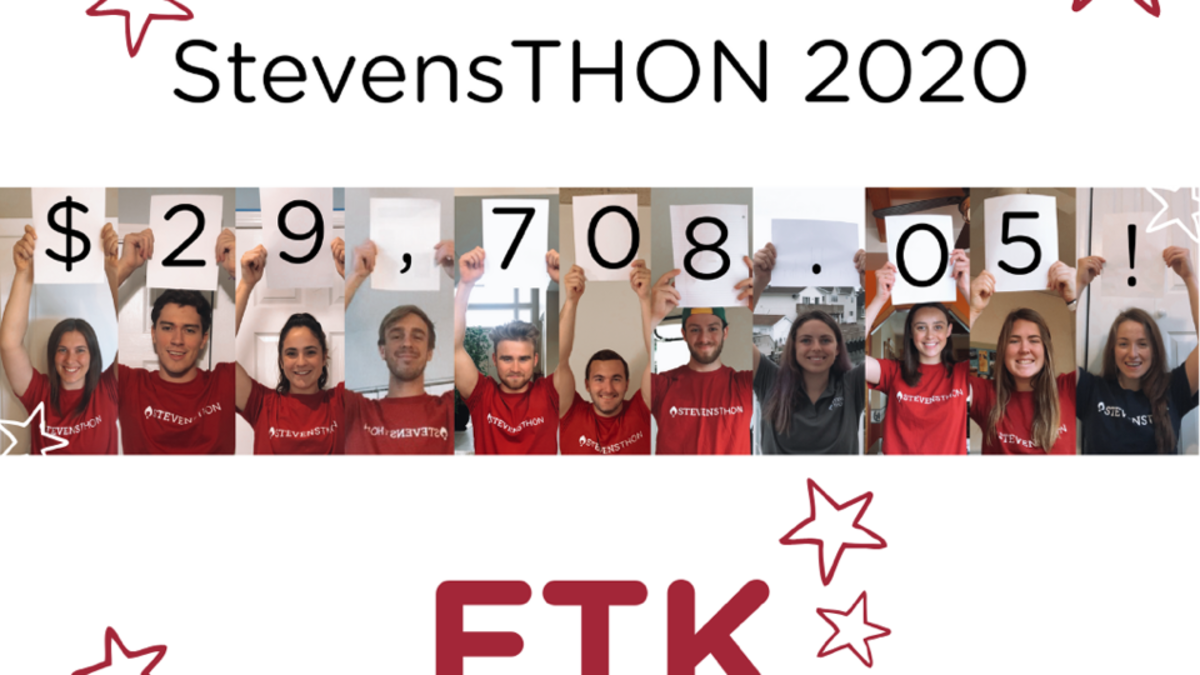 StevensTHON 2020 team hold up placards to display the total amount raised at the end of the dance marathon