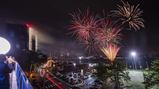 Fireworks over the Hudson river with the residential towers in the background