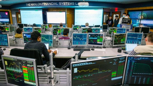 computer monitors showing financial data