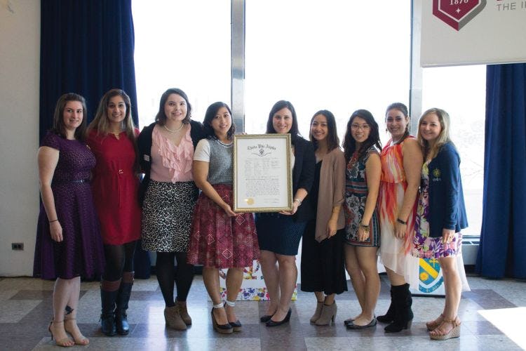 Kristine Du ’12 pictured with sisters of Theta Phi Alpha at the fifth anniversary celebration of the sorority’s Founder’s Day.