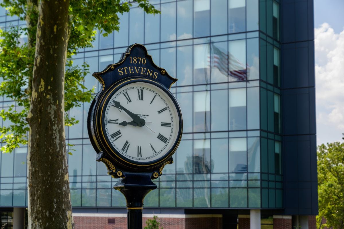 Stevens clock with the University Center Complex in the background