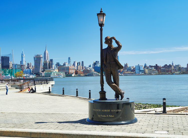 Hoboken's famous Frank Sinatra on a bright sunny day, with the some of the New York City skyline in the background and just a few minutes walk from the Stevens Institute of Technology's campus