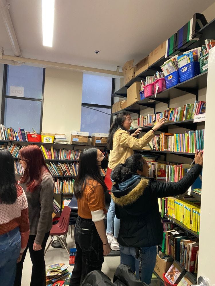 Volunteers organizing the Hoboken Charter School library