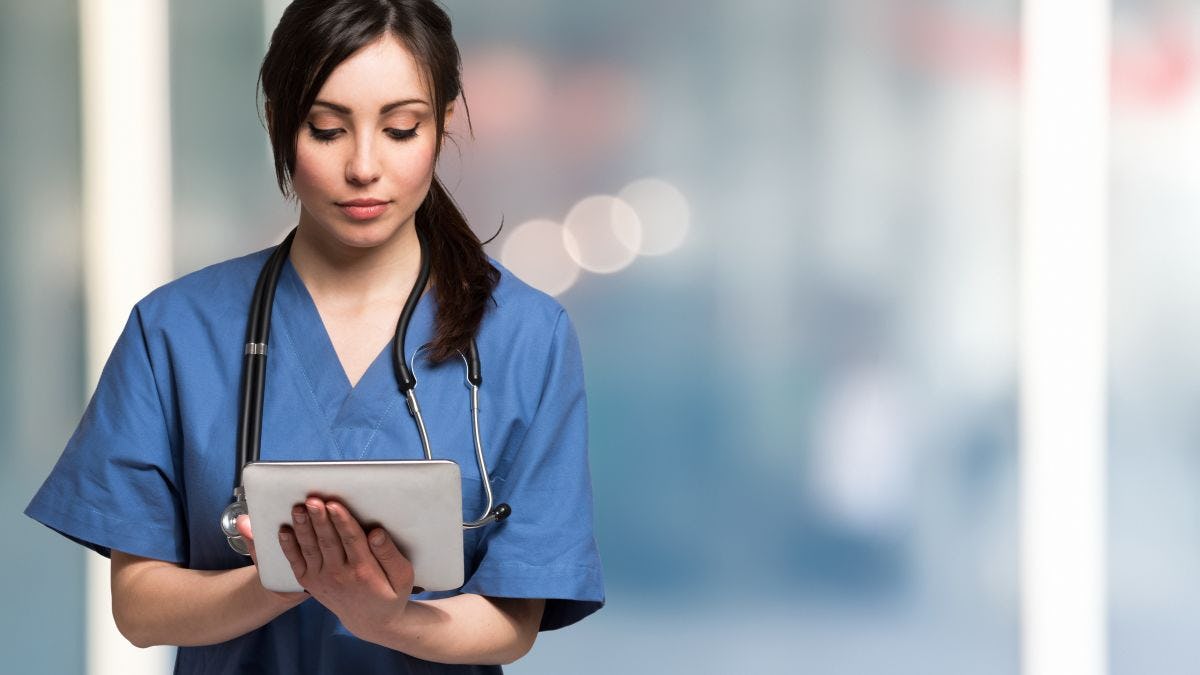 female doctor holding a tablet