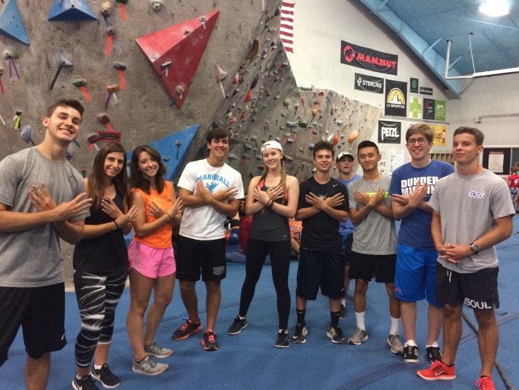 Group of students rock climbing during Pre Orientation