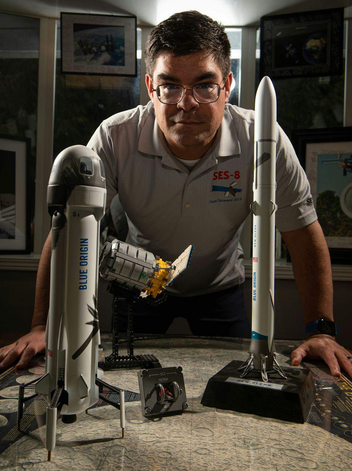 Portrait of Jonathan Matos with model rockets