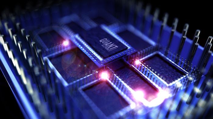 Computer chips in purple light with "Quant" printed on chip