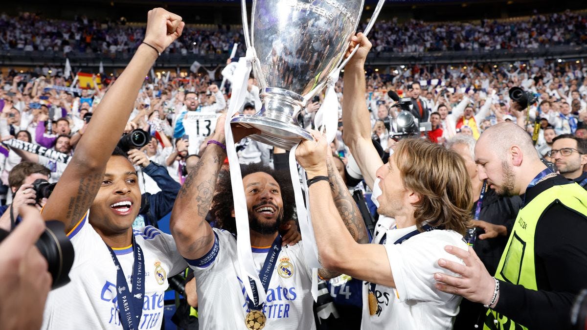 Real Madrid team holding up trophy