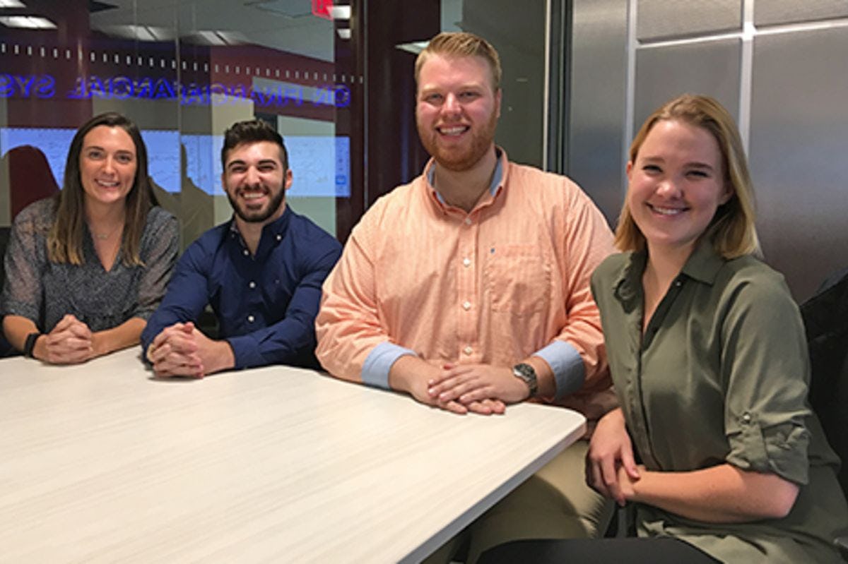 Four students collaborate in the high-tech Hanlon Lab.