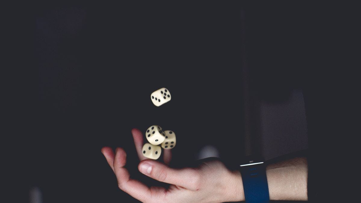 Photo of person tossing dice