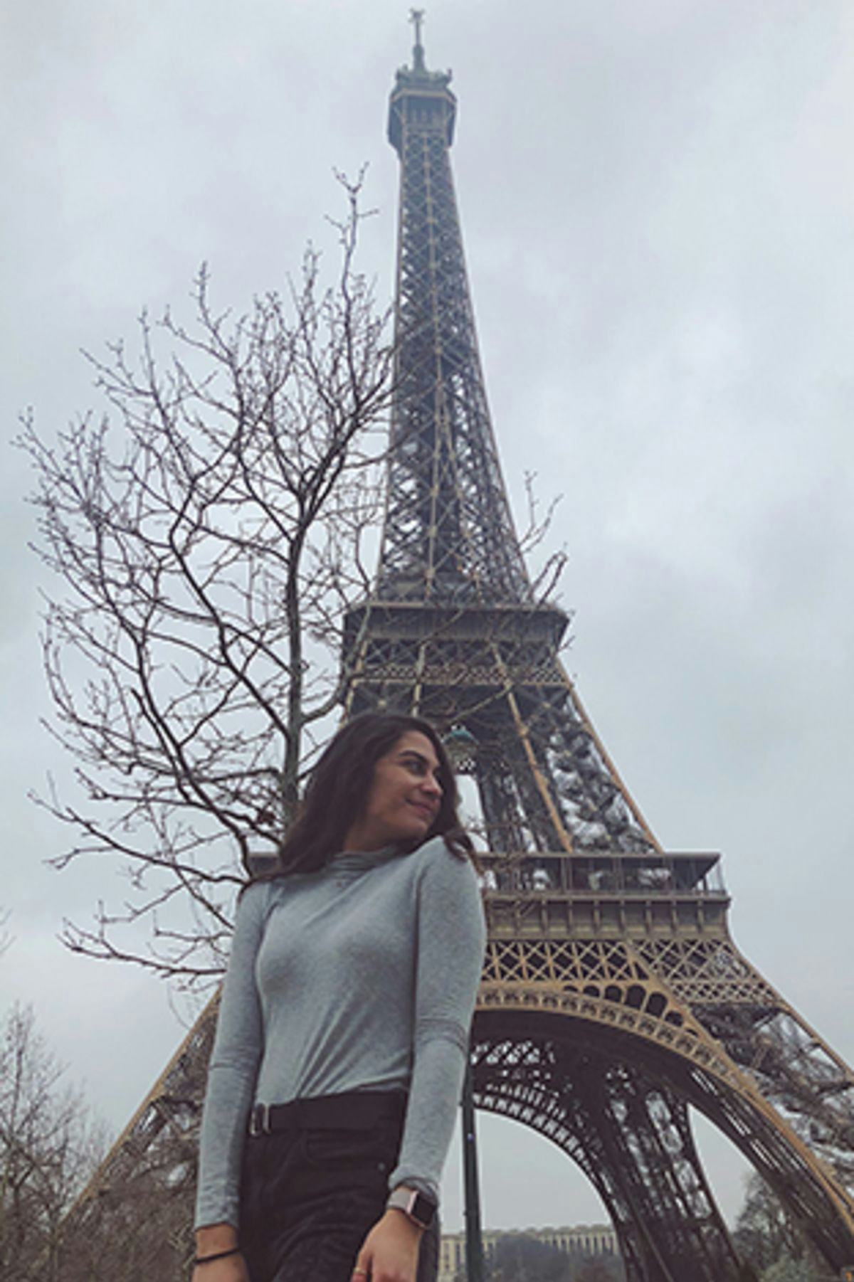 Sheila outside the Eiffel Tower in Paris.