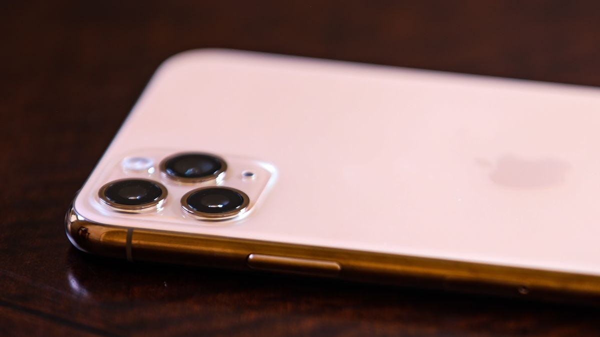 a photo of an Apple iPhone laying screen side down so the camera lenses are visible.