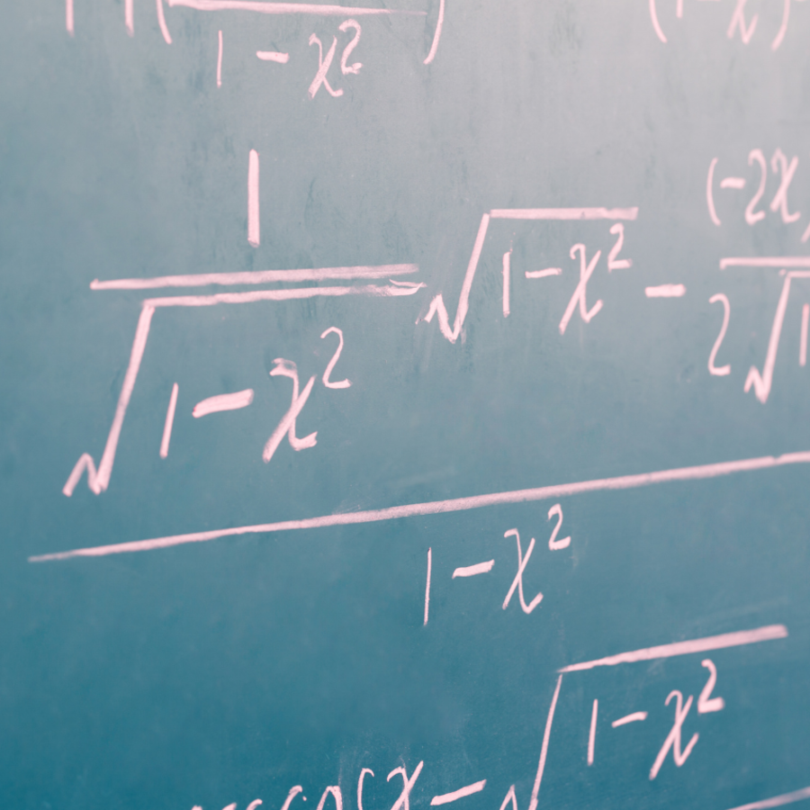 complex math equations written on a chalkboard