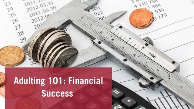 Coins and calculator on paper representing financial success