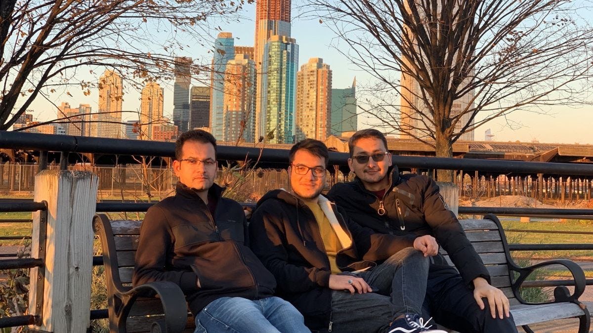 Iqbal Sadat M.S. '20, Hosam Stanikzai M.Eng. ’20 and Mohammad Hassany M.S. '20 sitting on bench