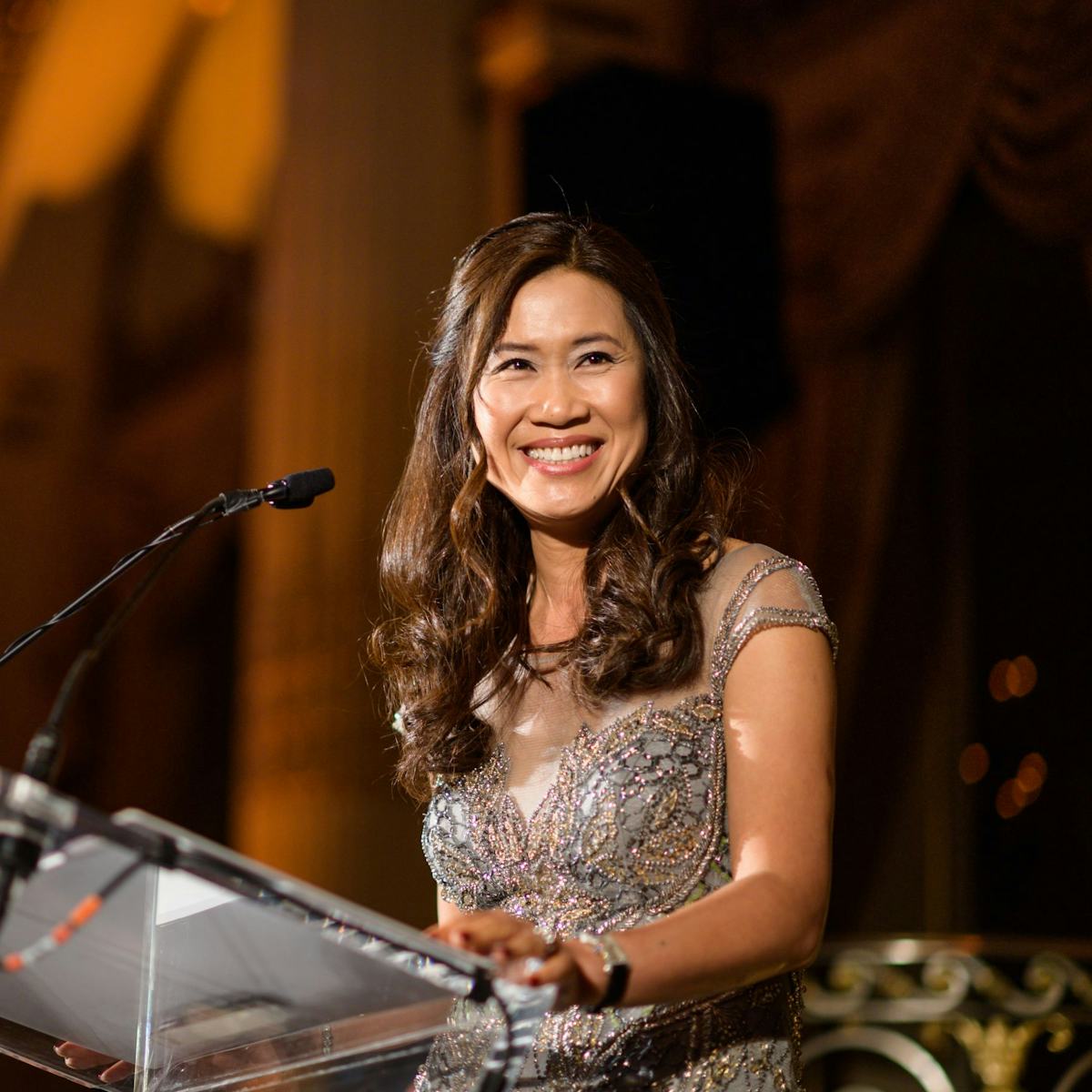 Stevens alumna Pam Cheng smiling as she speaks at an event