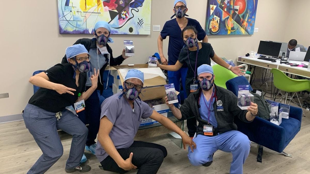 Group of doctors posing with donated face masks