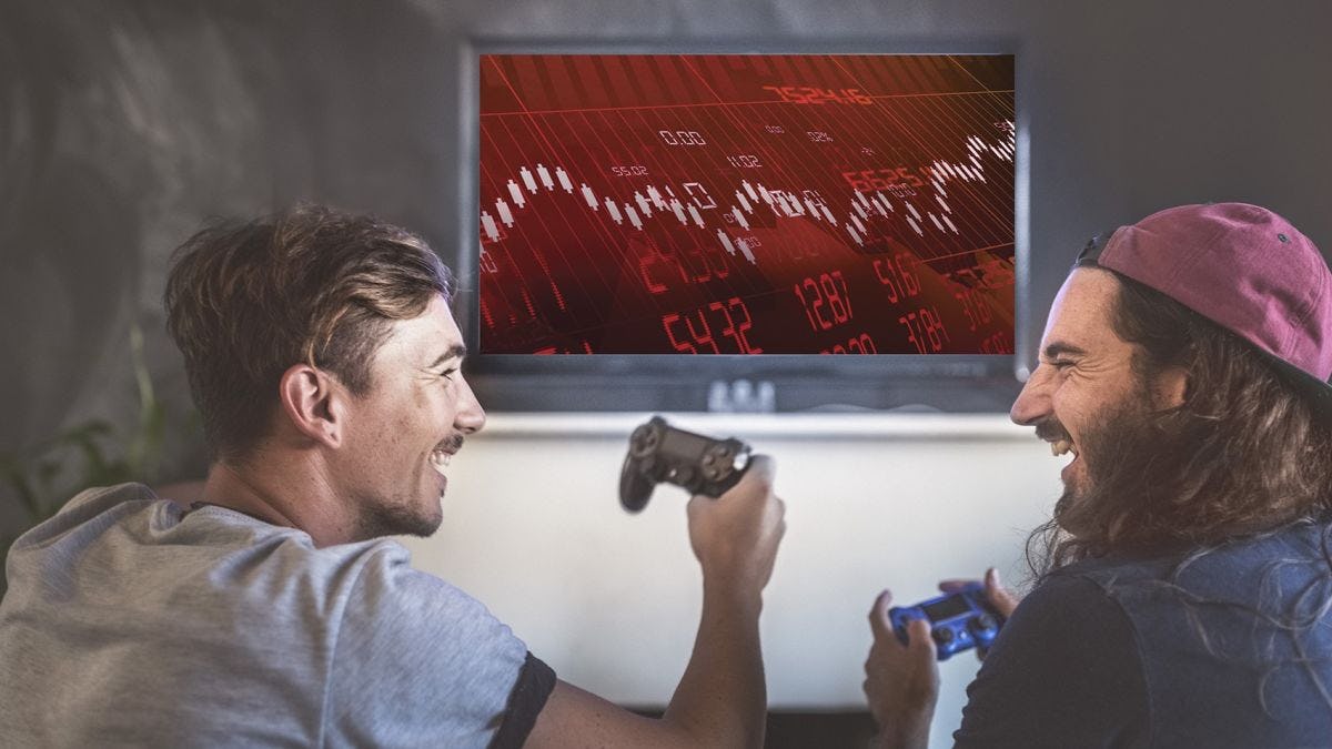 Two young men playing video games. The screen shows financial data in peril.