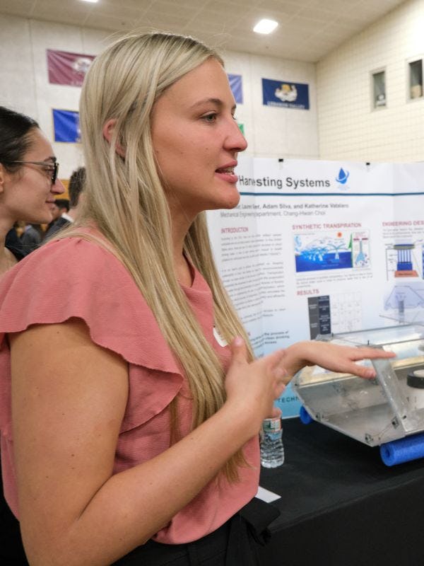 Woman student presents her work at the Innovation Expo