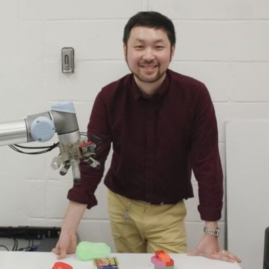 Long Wang with robotic hand