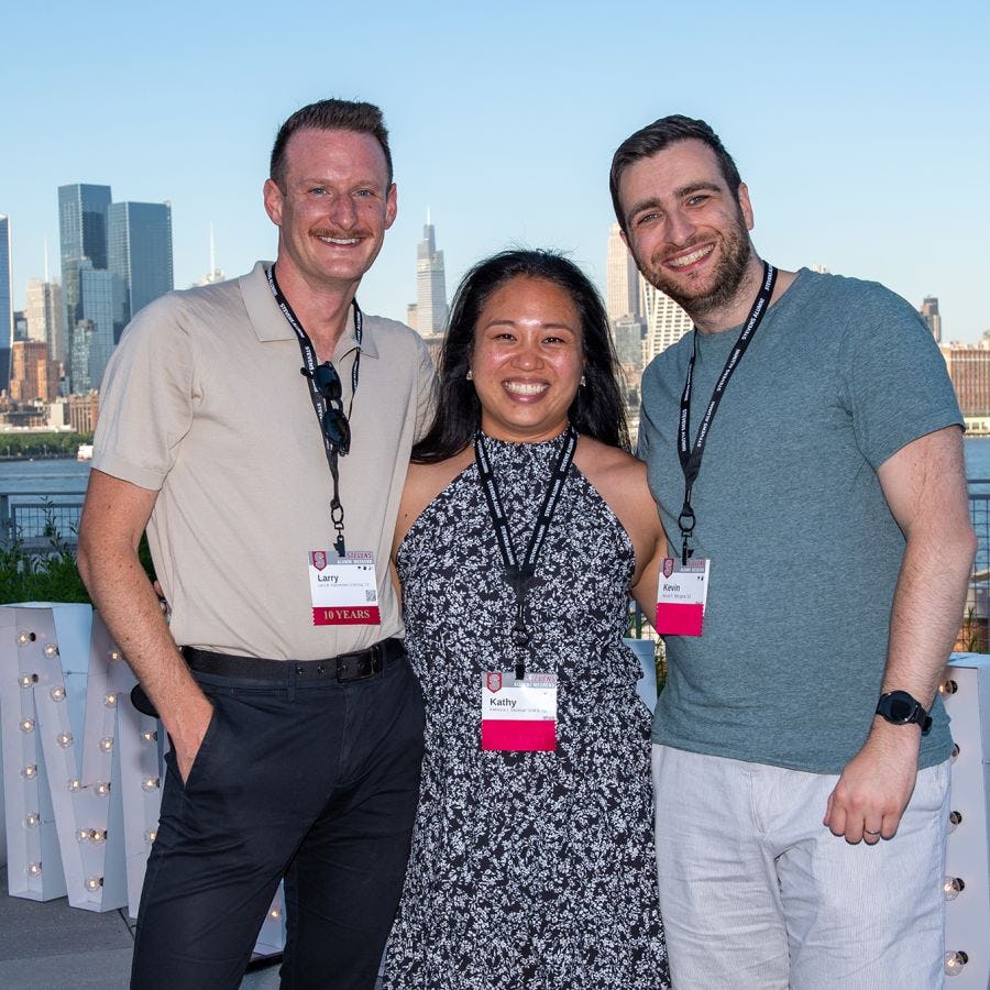 Three alumni enjoy Party with a View on the Babbio patio during Stevens Alumni Weekend