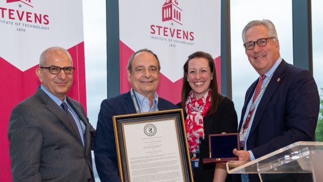 President Farvardin, Megan Stevens, and John Dearborn pose with 2023 Alumni Award recipient Frank Vastano