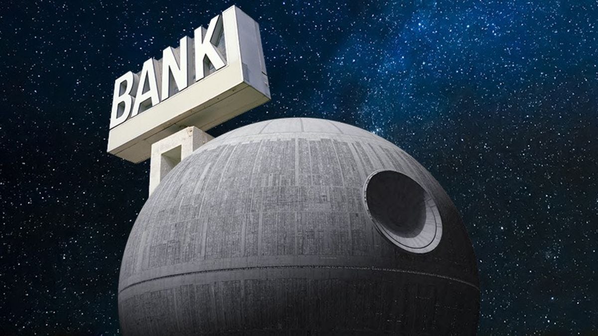 The Death Star against a night sky with a bank sign on it.