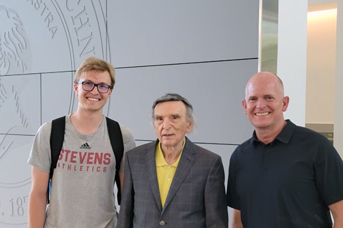 Mr. Battista, at center, with Stevens tennis player Olof Persson, left, and Assistant Vice President and Director of Athletics and Recreation Russ Rogers.