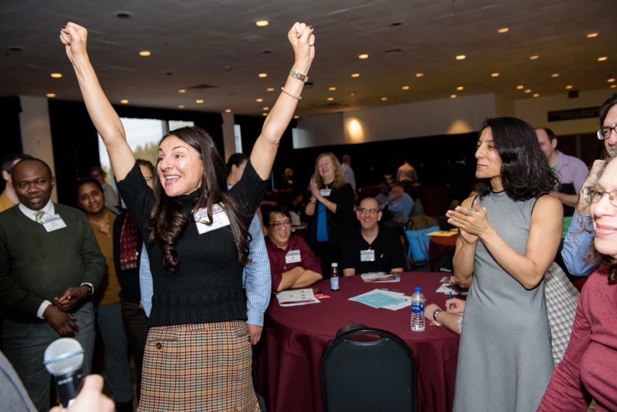 The winner of the rock—paper—scissors tournament celebrates with her fellow participants. CREDIT: Jeff Vock