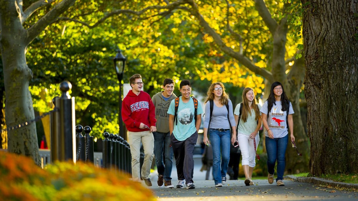 Students walking on campus in Fall