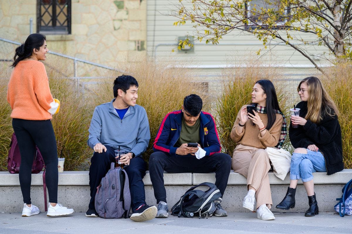 Students on campus socializing.