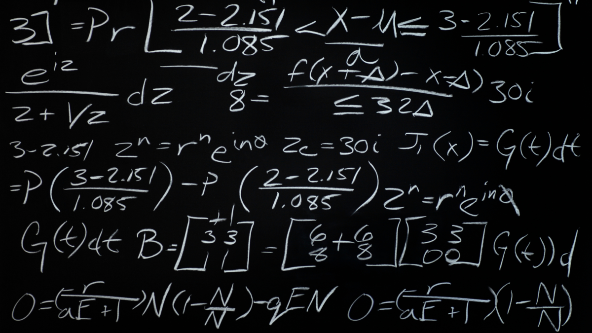 Equations handwritten on blackboard