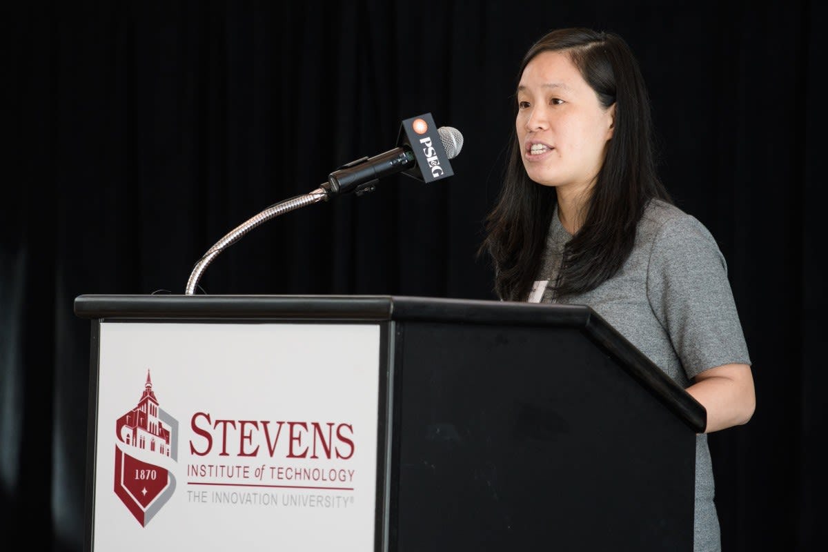 Stephanie Lee speaking at podium