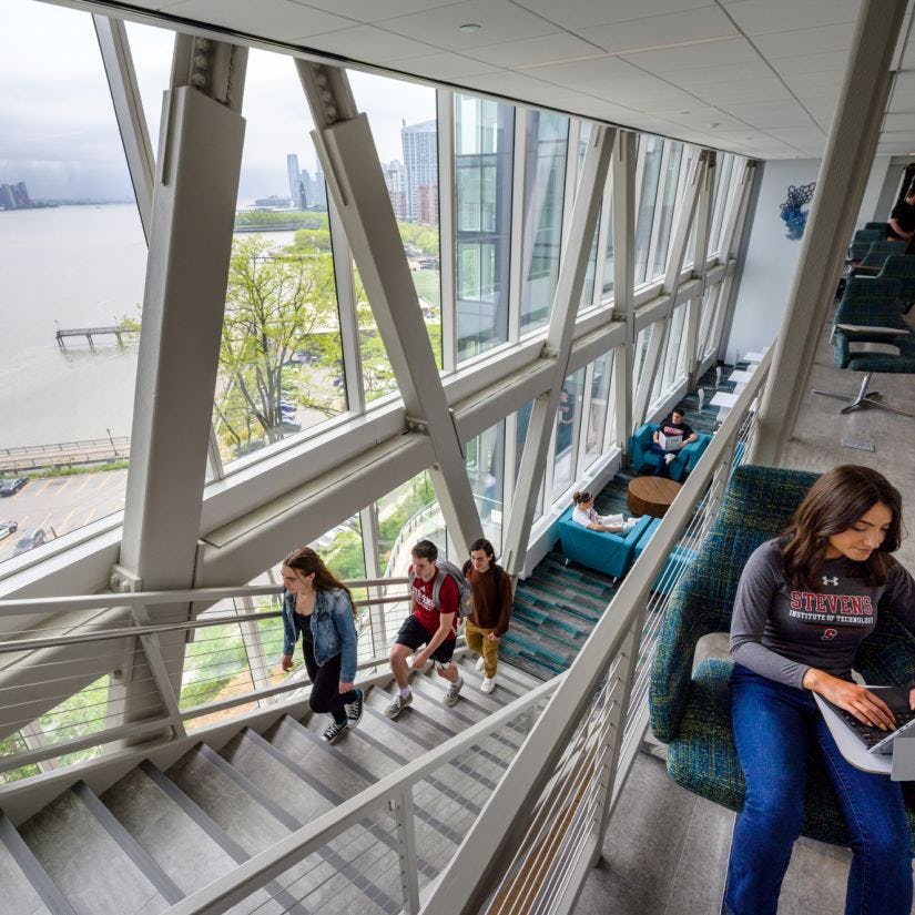 Students socialize in the skybridge area of the UCC.